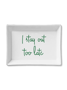 White rectangular tray with green text 'I stay out too late' on a white background