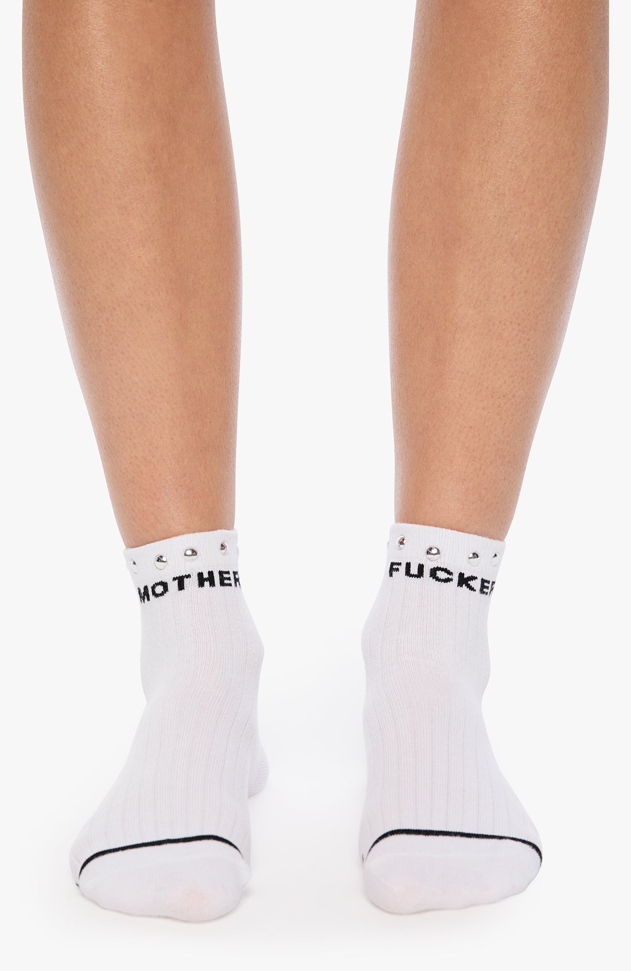 White socks with black text worn by a person on a white background