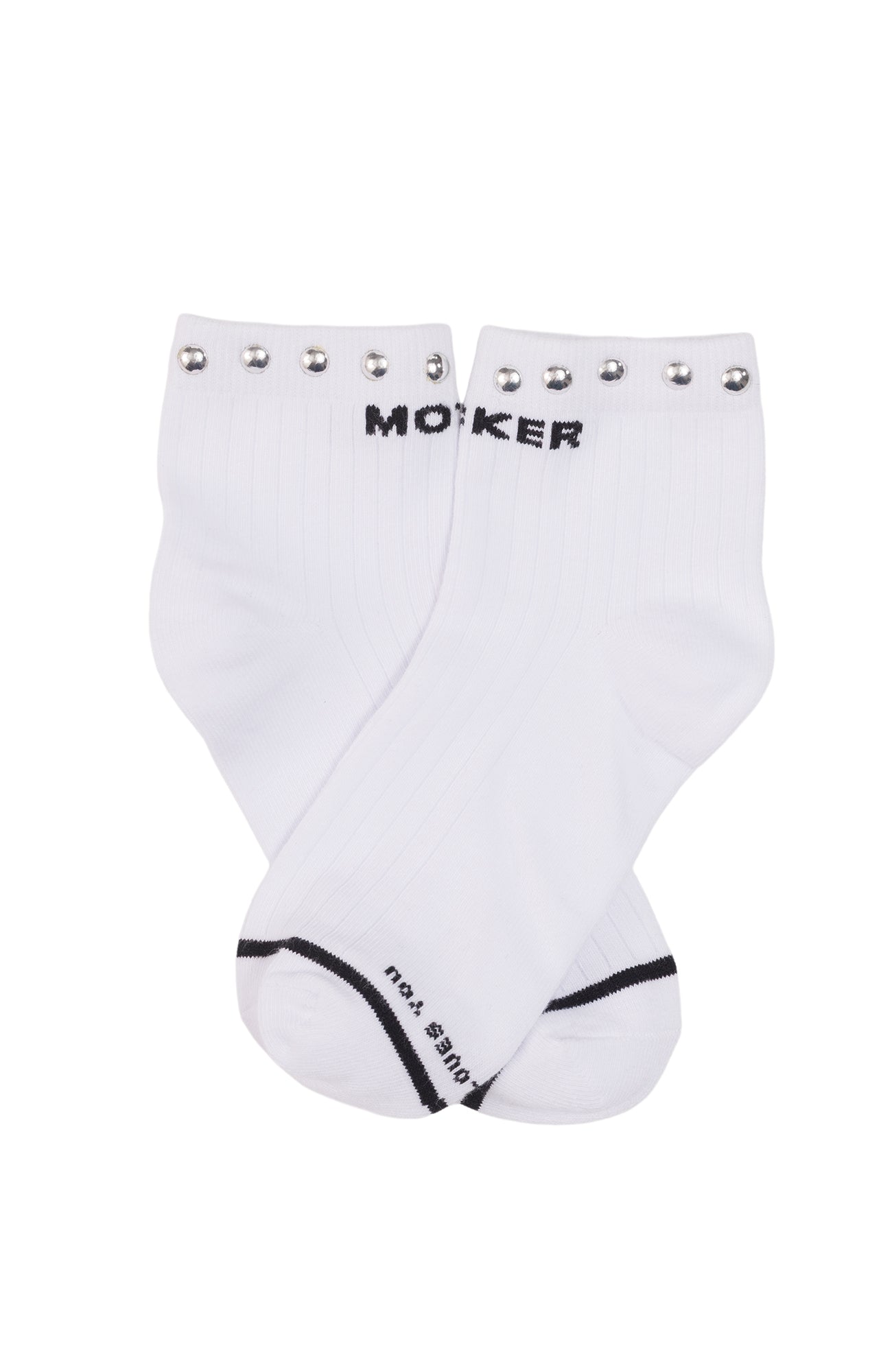 A pair of white crew socks with black 'MOKER' branding on the top cuff, decorated with silver metal studs, and black trim on the toes.