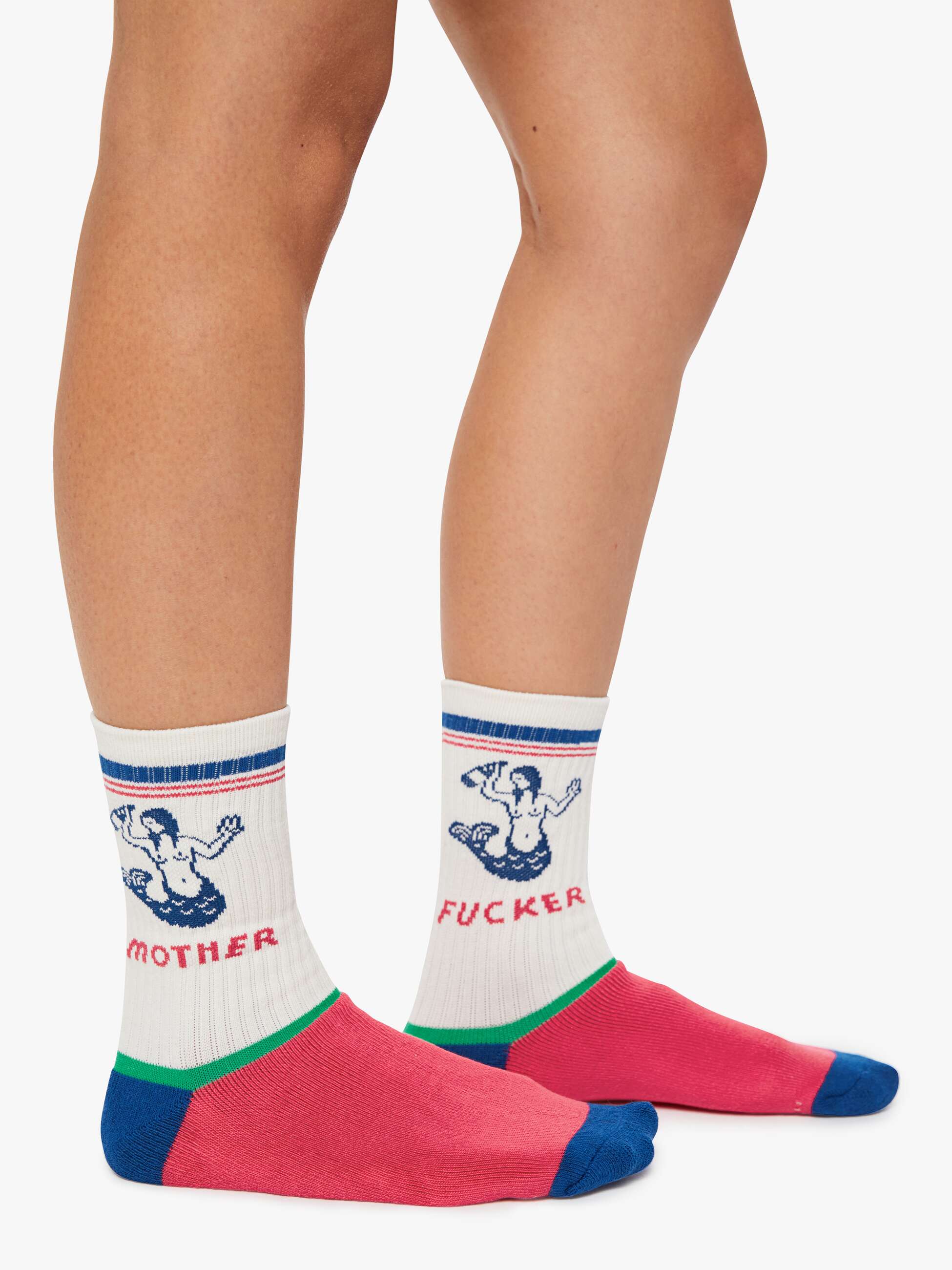 Colorful socks with graphic designs and text worn by a person on a white background