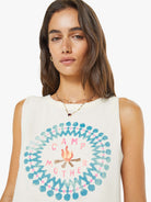Woman wearing a sleeveless shirt with 'Camp Mother' design on a white background