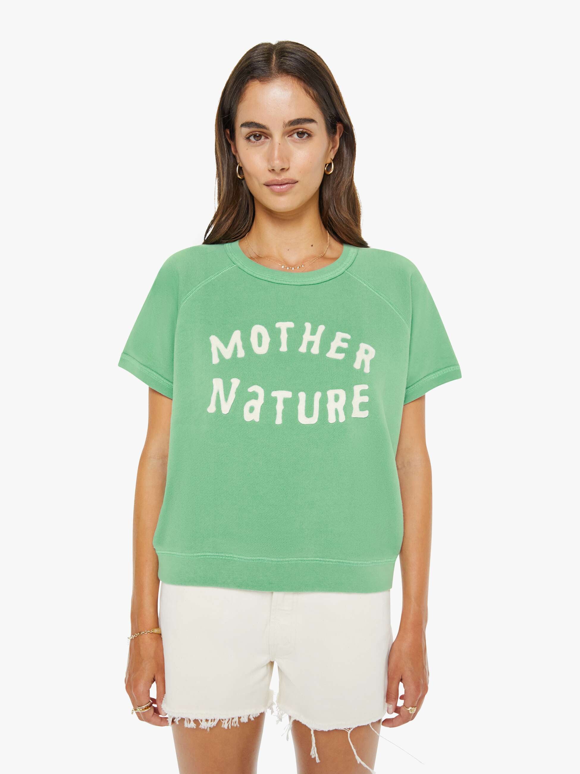 Woman wearing a green 'Mother Nature' t-shirt on a white background
