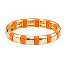Gold and orange bracelet on a white background