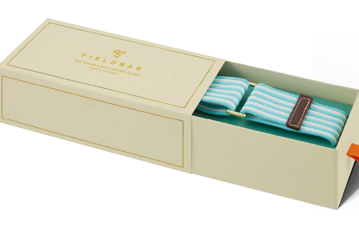 Open beige box displaying a pair of turquoise striped socks with brown accents, branded 'Fieldbar'.