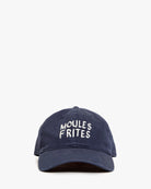 Navy blue cap with 'MOULES FRIITES' text on a white background