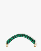 Green and black braided bracelet with gold clasps on a white background