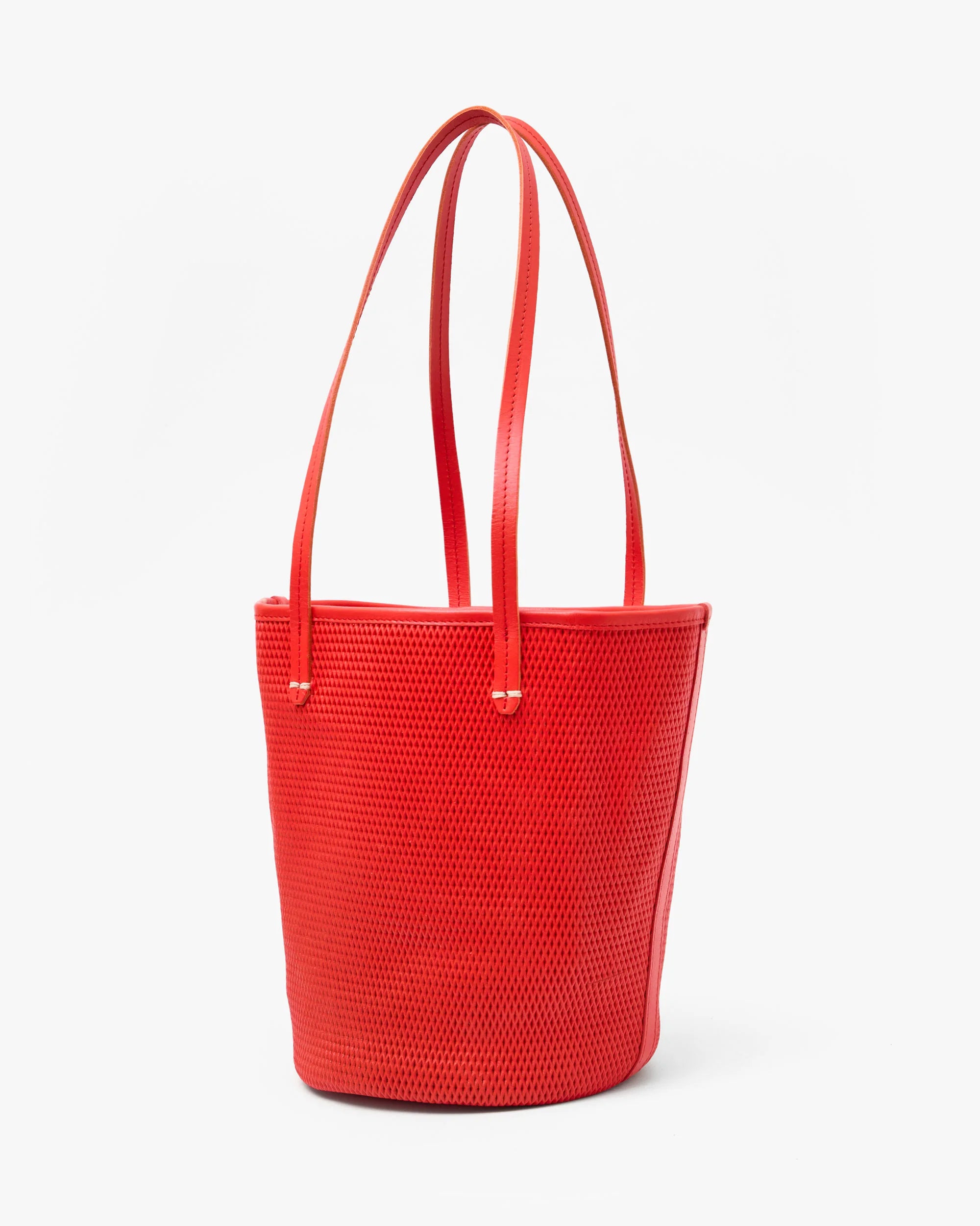Red woven handbag on a white background