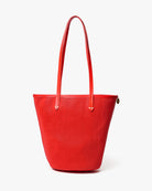 Red textured handbag on a white background