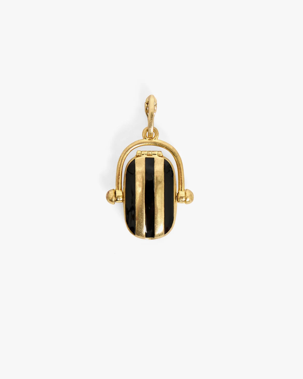 A gold-toned pendant shaped like a small handbag with a black and gold striped flap, shown on a plain light gray background.