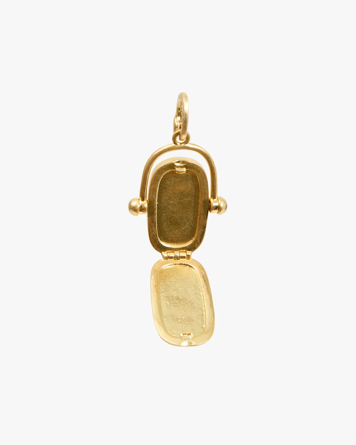 A gold pendant charm shaped like a small open locket or case, photographed against a plain light gray background.