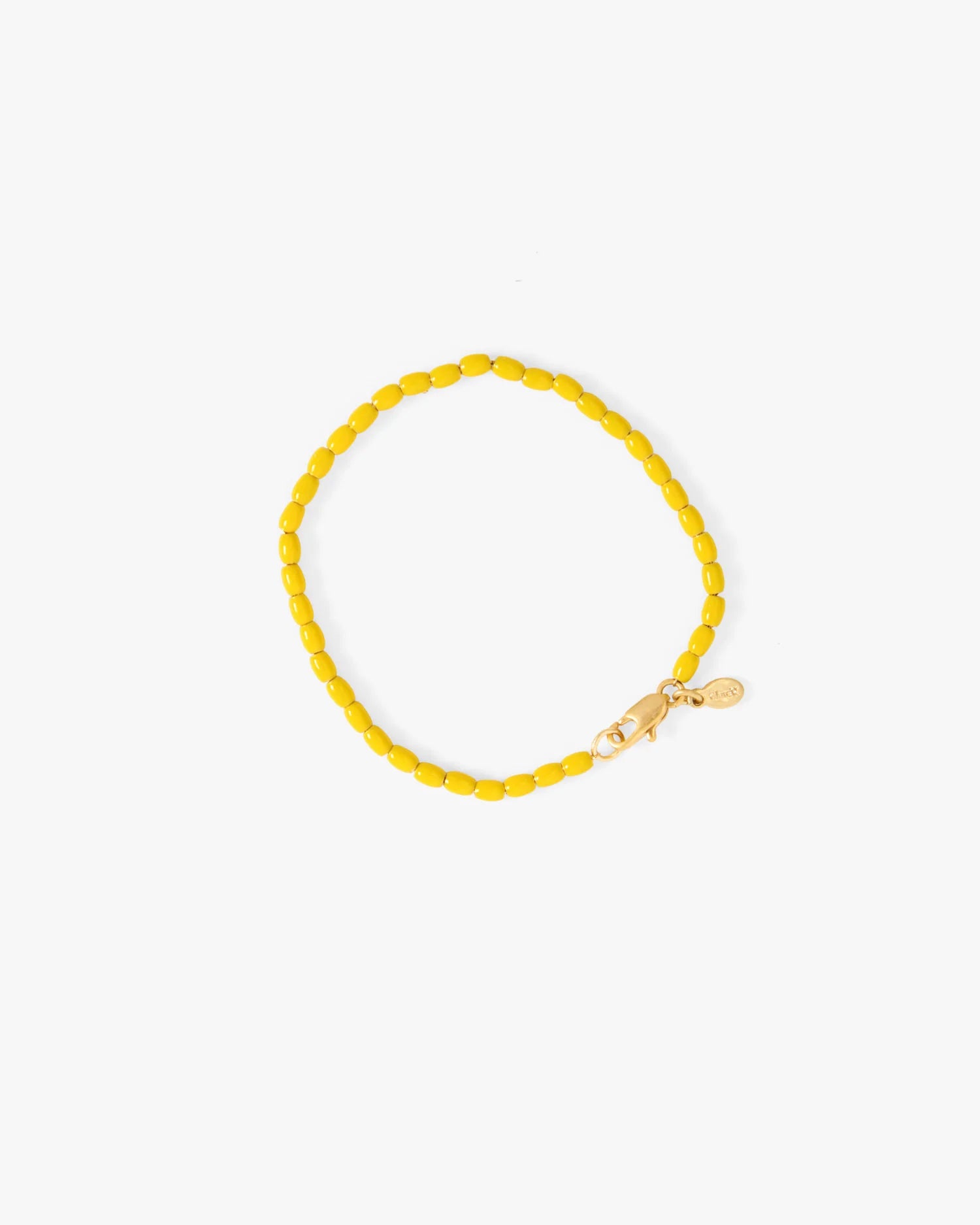 Yellow beaded bracelet on a white background