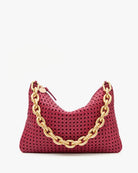 Red handbag with a gold chain detail on a white background