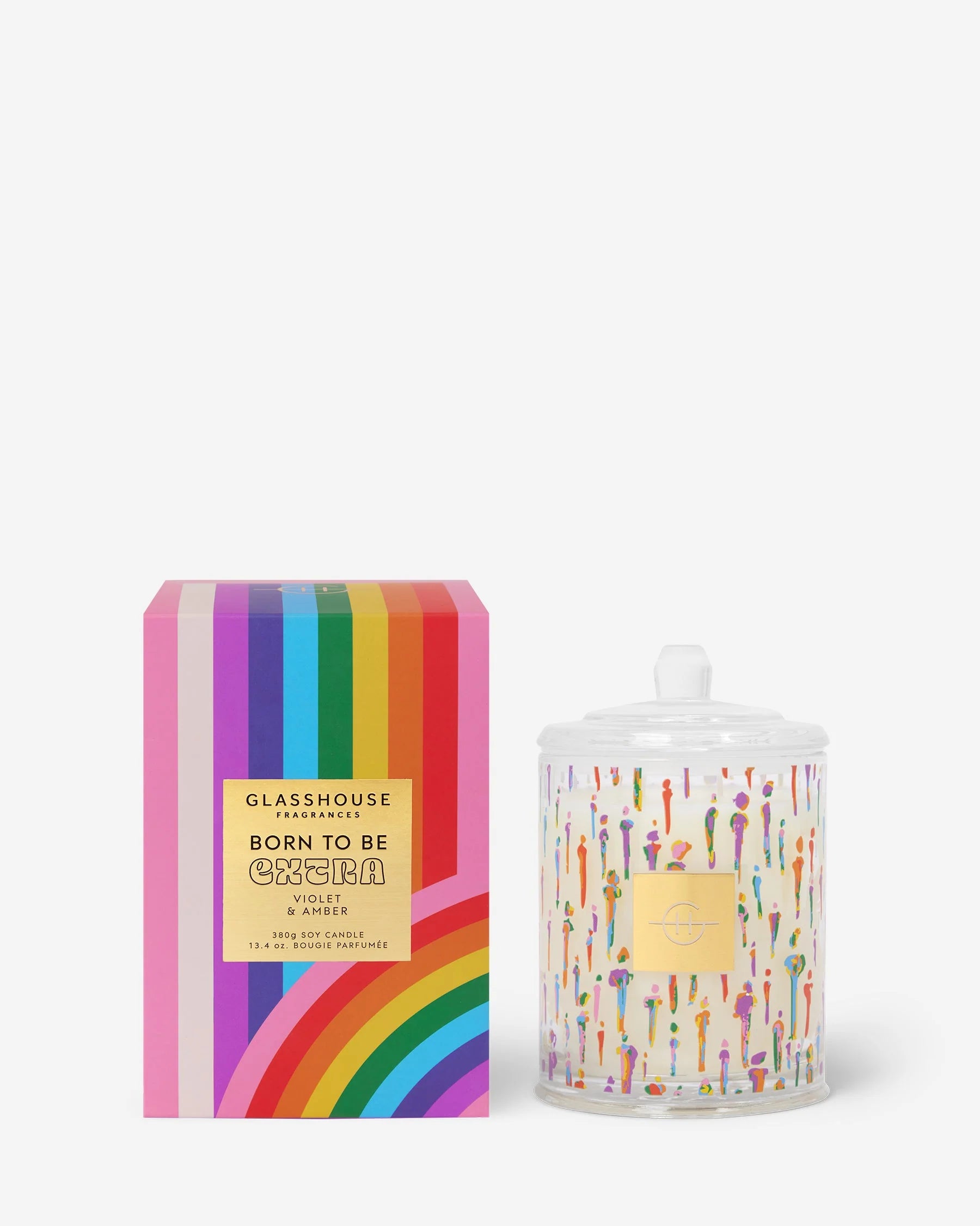 Glasshouse Candle Co candle with rainbow striped packaging on a white background