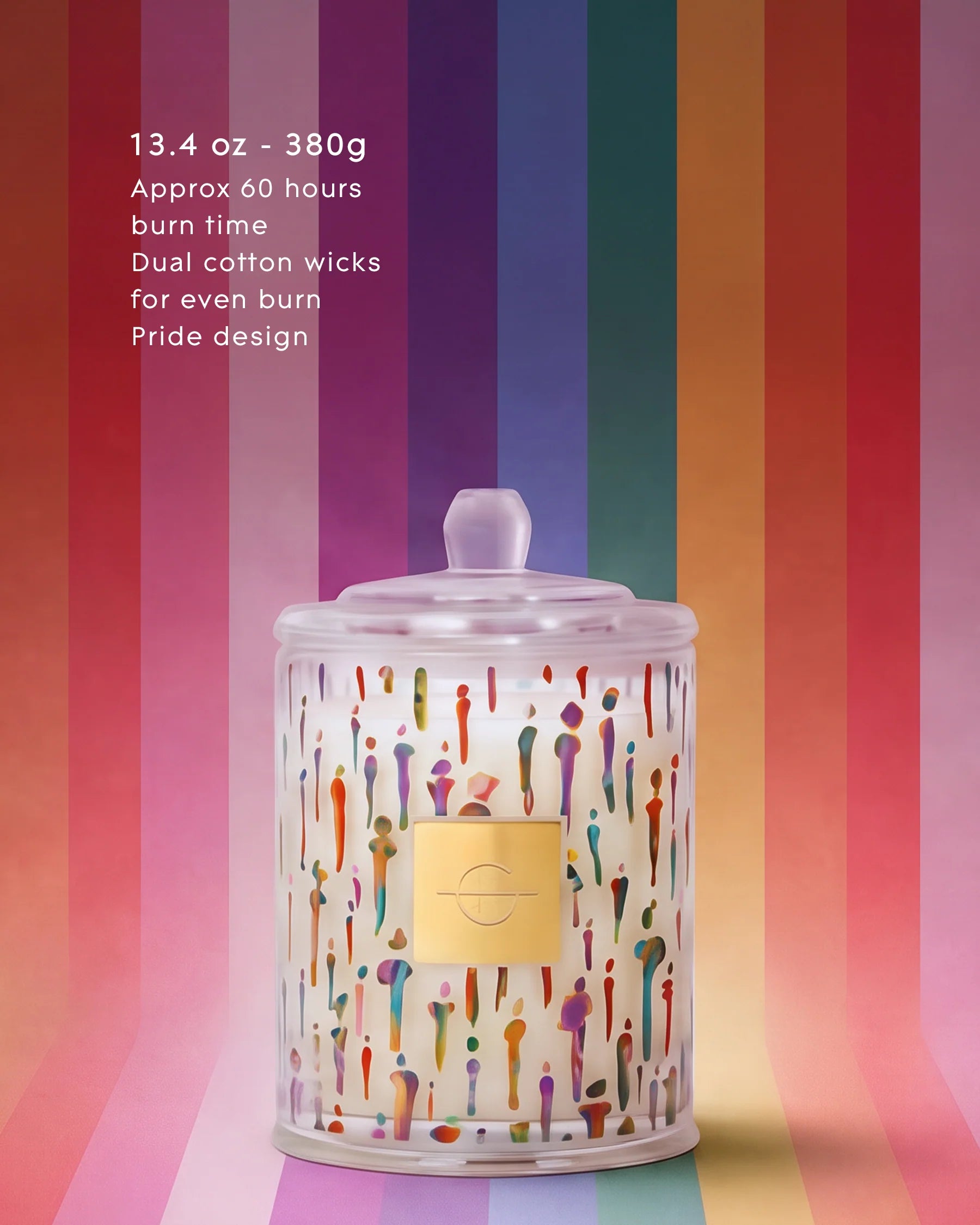 Candle with colorful design on a striped background