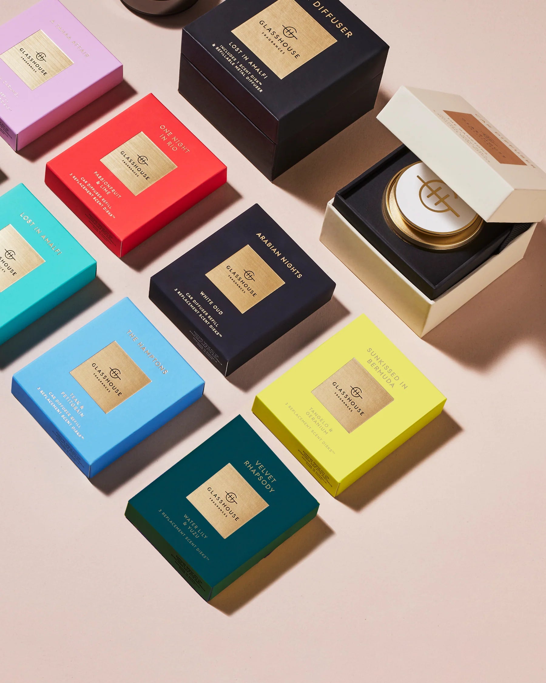 Colorful boxes of Aesop products on a beige background