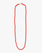 A vibrant red beaded necklace with a gold clasp, laid out vertically on a clean white background.