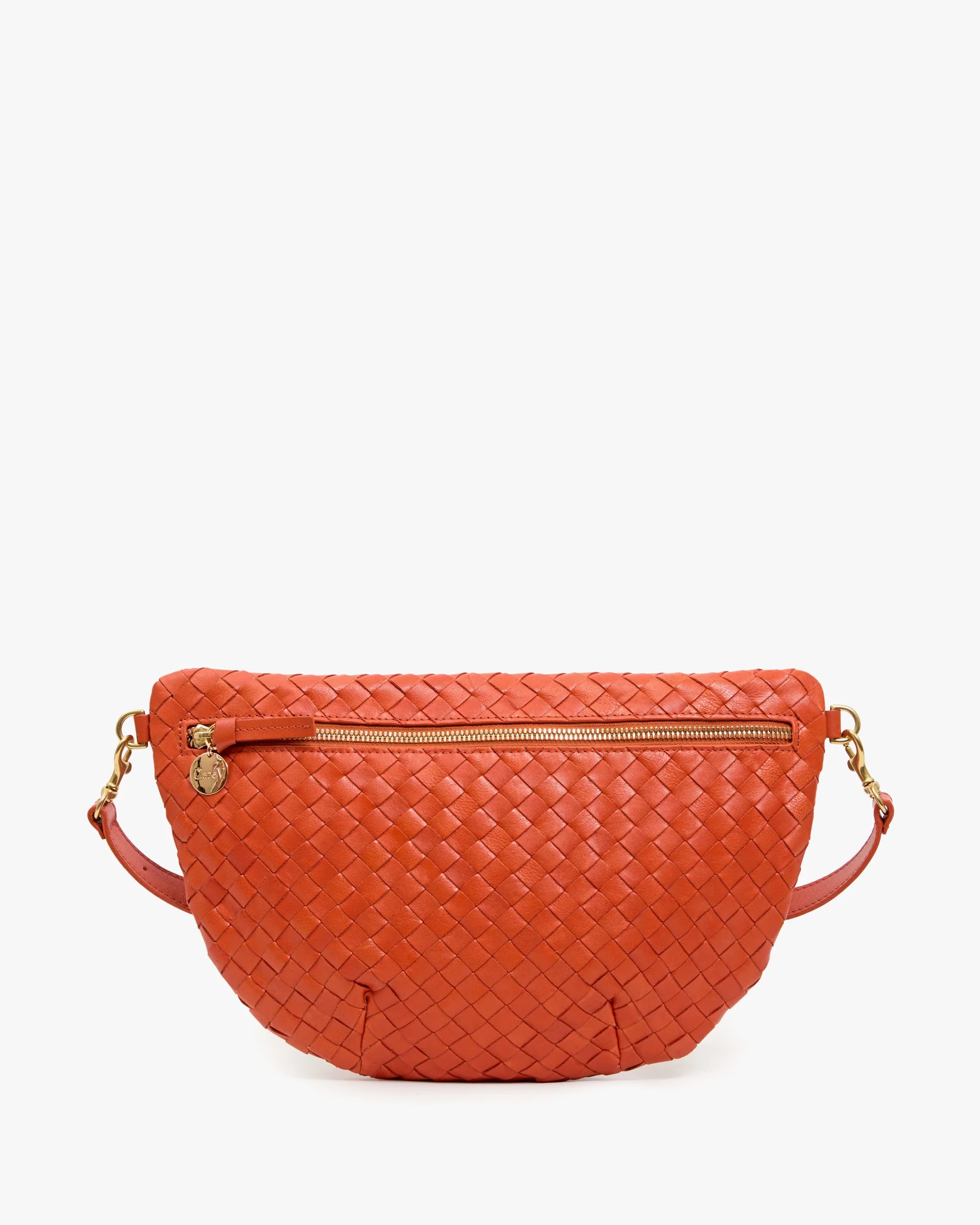 Orange woven handbag with gold zipper and chain on a white background