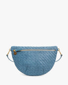 A blue woven leather half-moon crossbody bag with a top zipper, gold-tone hardware, and a matching blue strap, shown against a plain white background.