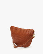 Brown woven handbag with a gold clasp on a white background