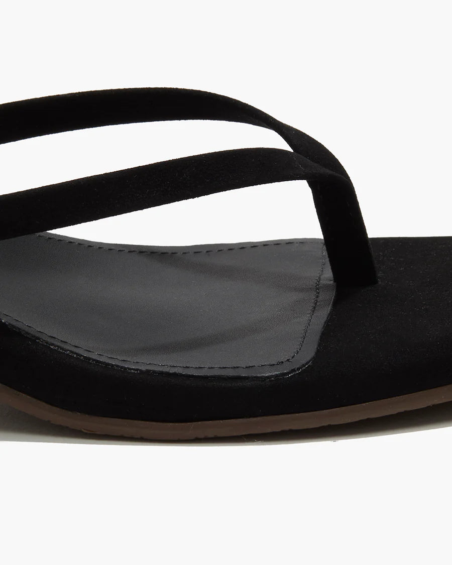 Black sandal with a strap on a white background