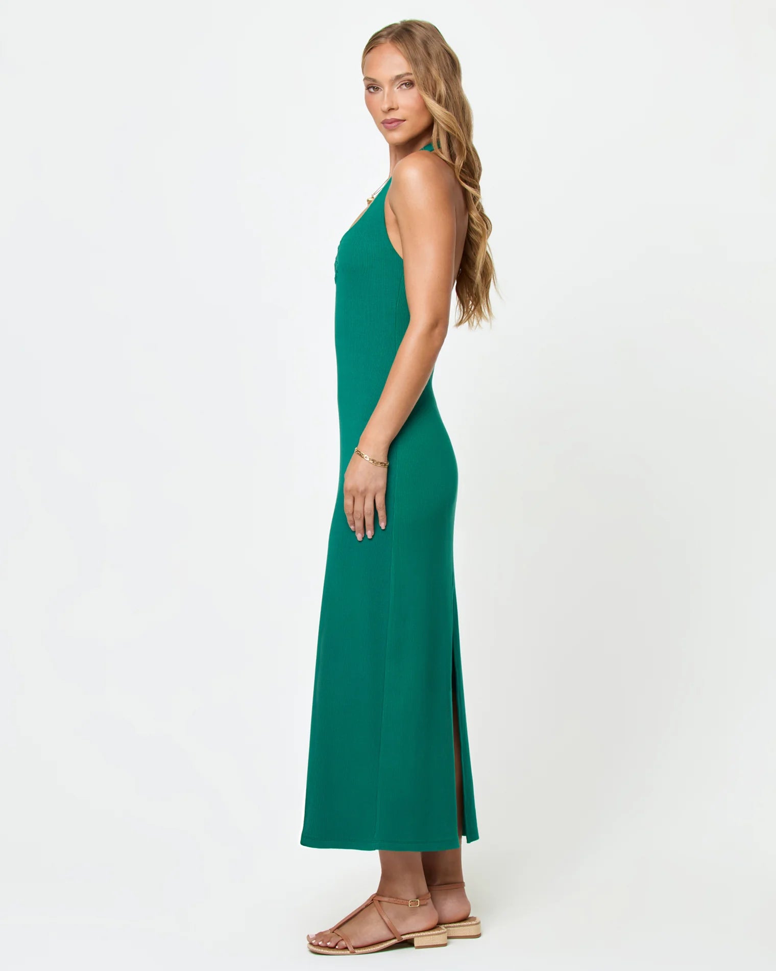 Woman wearing a green dress on a white background