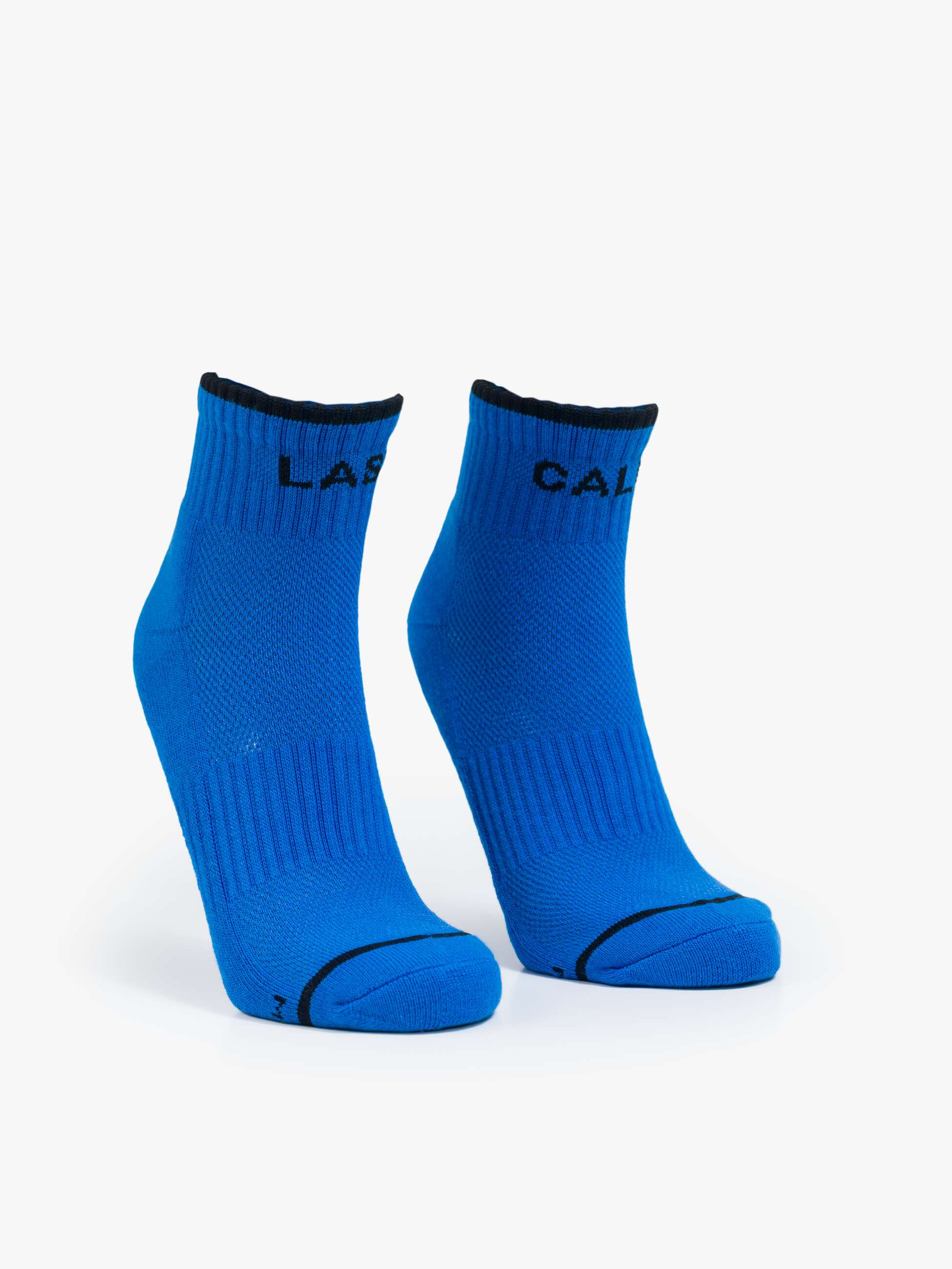 Pair of blue socks with black accents on a white background