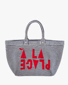 Striped tote bag with red text on a white background