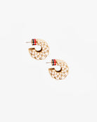 Pair of gold hoop earrings with red and blue accents on a white background