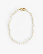 Pearl necklace with a gold clasp on a white background
