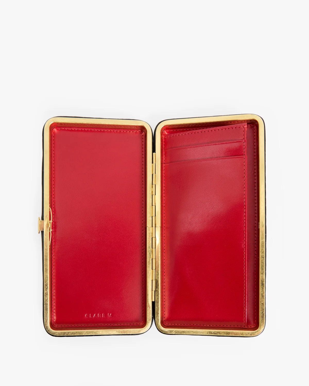 An open red leather clutch case with a gold-tone metal frame and interior card slots, photographed on a clean white background.