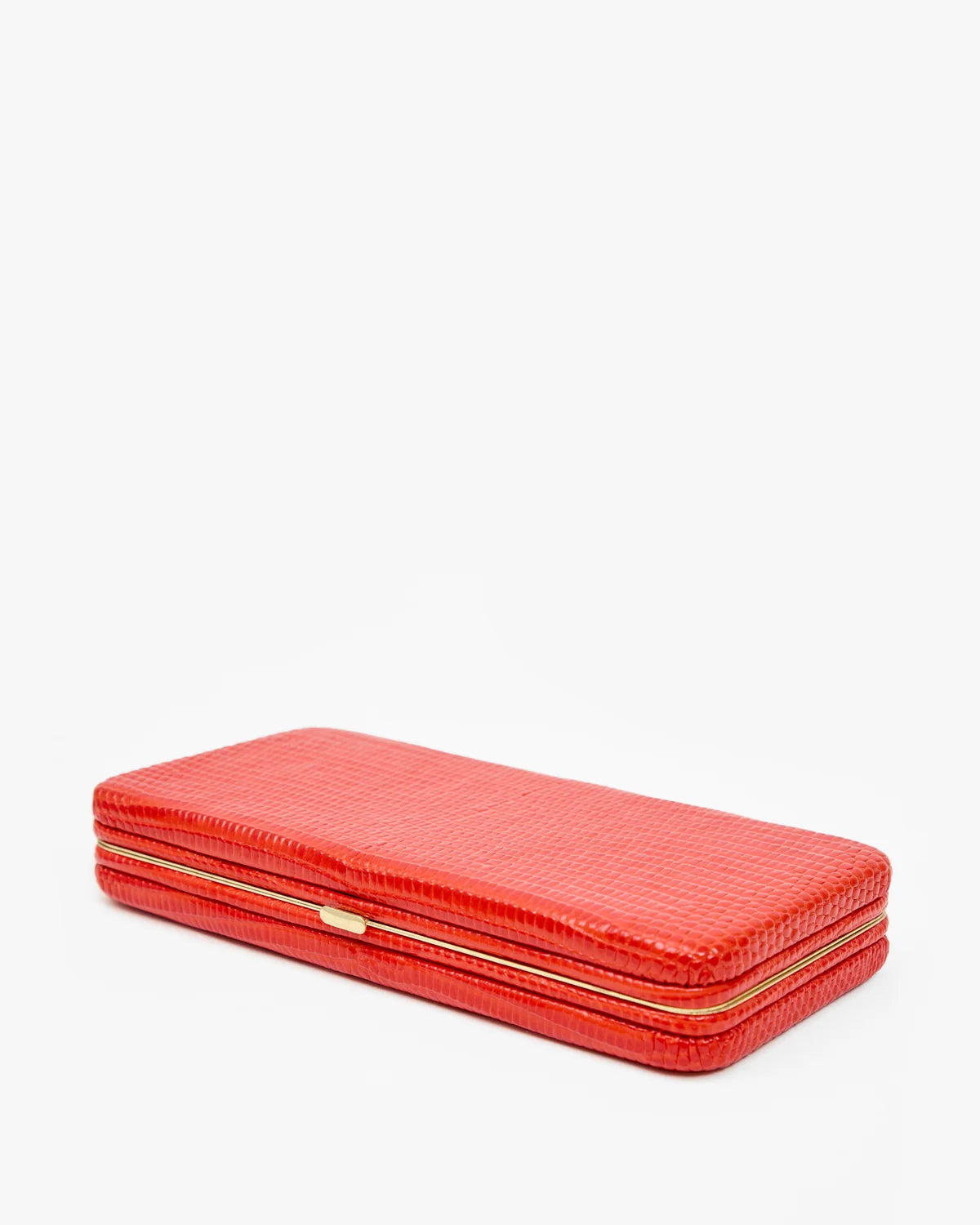 A bright red textured leather clutch case with gold-tone metal trim and a small gold clasp, photographed on a clean white background.