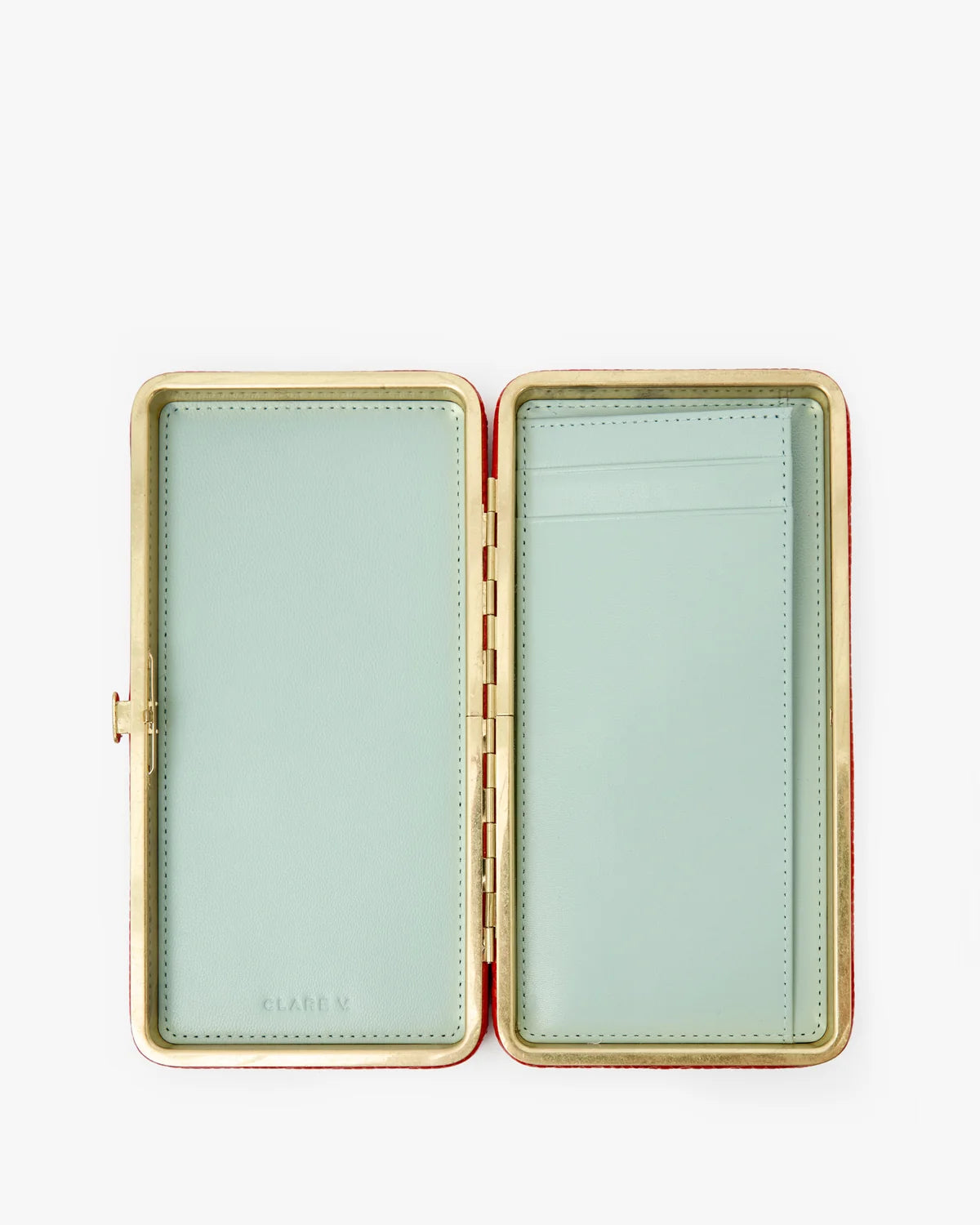 An open rectangular leather card case with a pale mint green interior and a gold-tone metal frame, photographed on a clean white background.