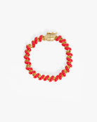 A gold-plated beaded bracelet with glossy red oval beads, displayed on a clean white background.