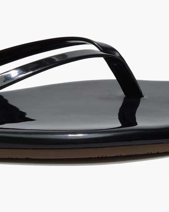 Black sandal with a strap on a white background