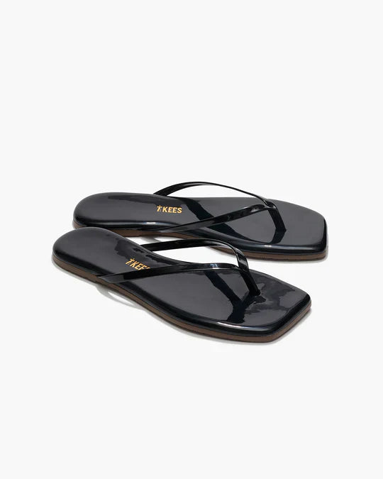Black sandals with a brand logo on a white background