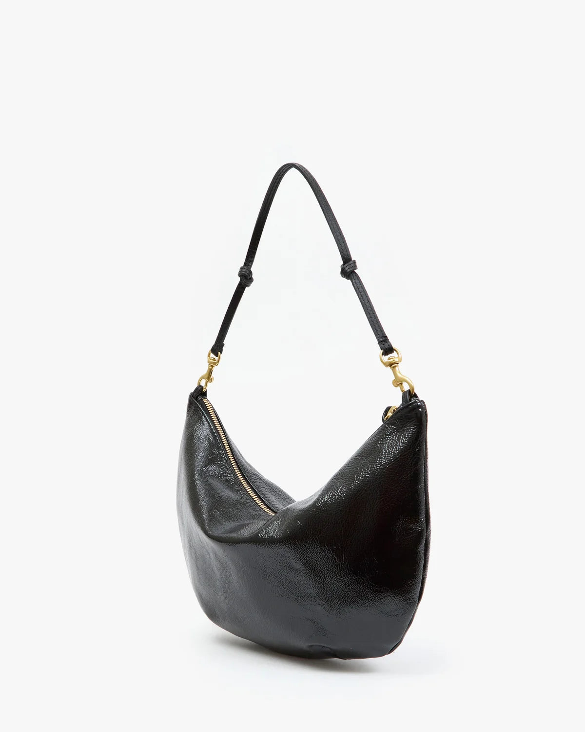 A black pebbled leather crescent-shaped shoulder bag with a single shoulder strap and gold-tone hardware, shown on a clean white background.