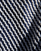 Close-up of navy blue fabric with white wavy pattern
