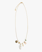 A delicate gold chain necklace with multiple charms, including a white pearl drop, a gold sun face charm, a small green stone charm, and a pink animal charm, displayed on a clean white background.