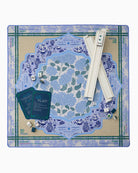 Board game set with blue and green floral pattern on a cardboard base