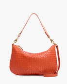 Orange woven handbag with a strap on a white background