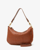 Brown woven handbag with gold accents on a white background