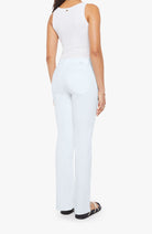 Person wearing a white sleeveless top and pants on a white background