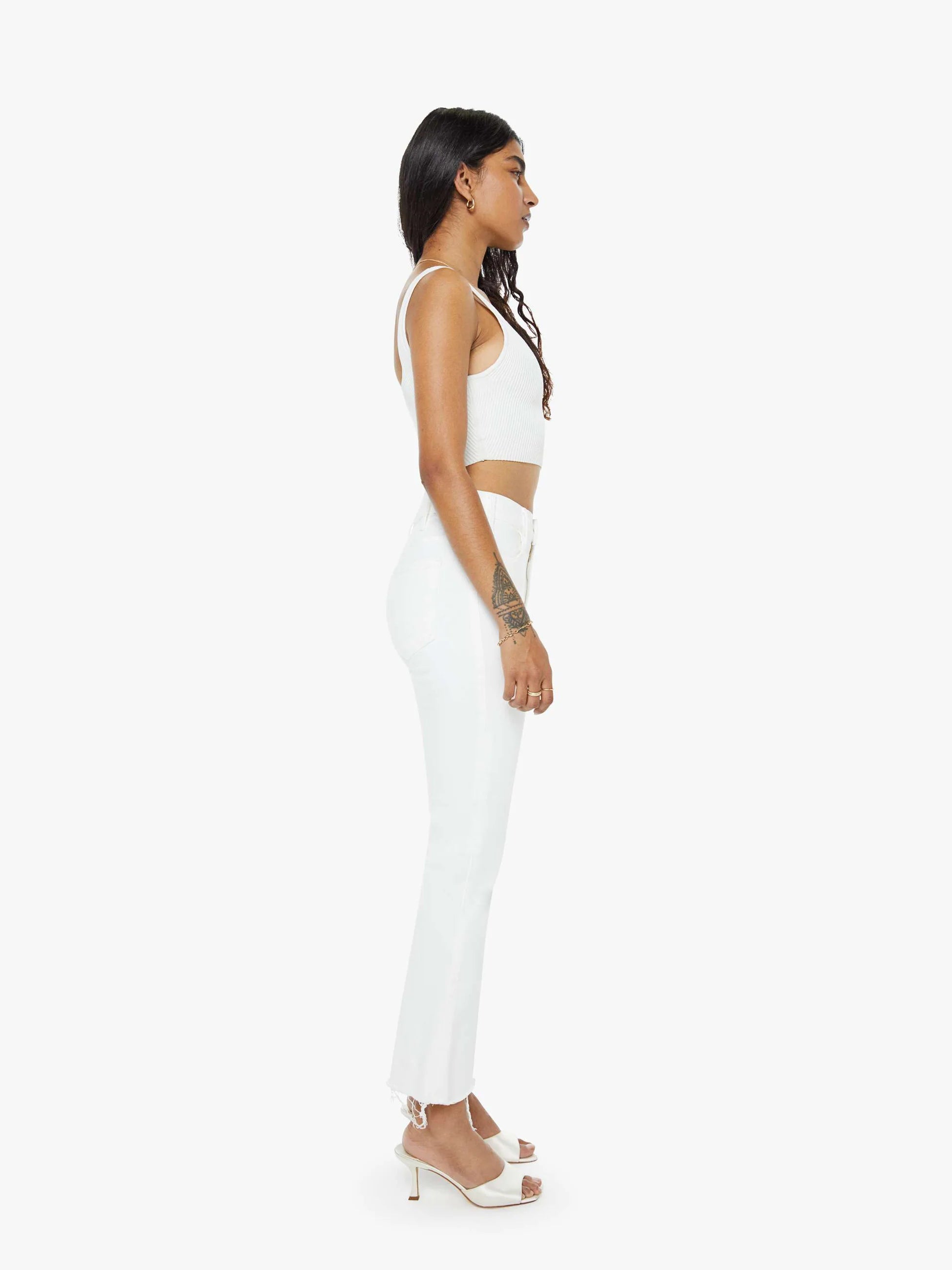 Woman wearing a white outfit on a white background