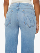 Light blue jeans with a brand logo on a white background