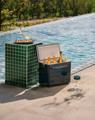 Cooler box with drinks by a poolside
