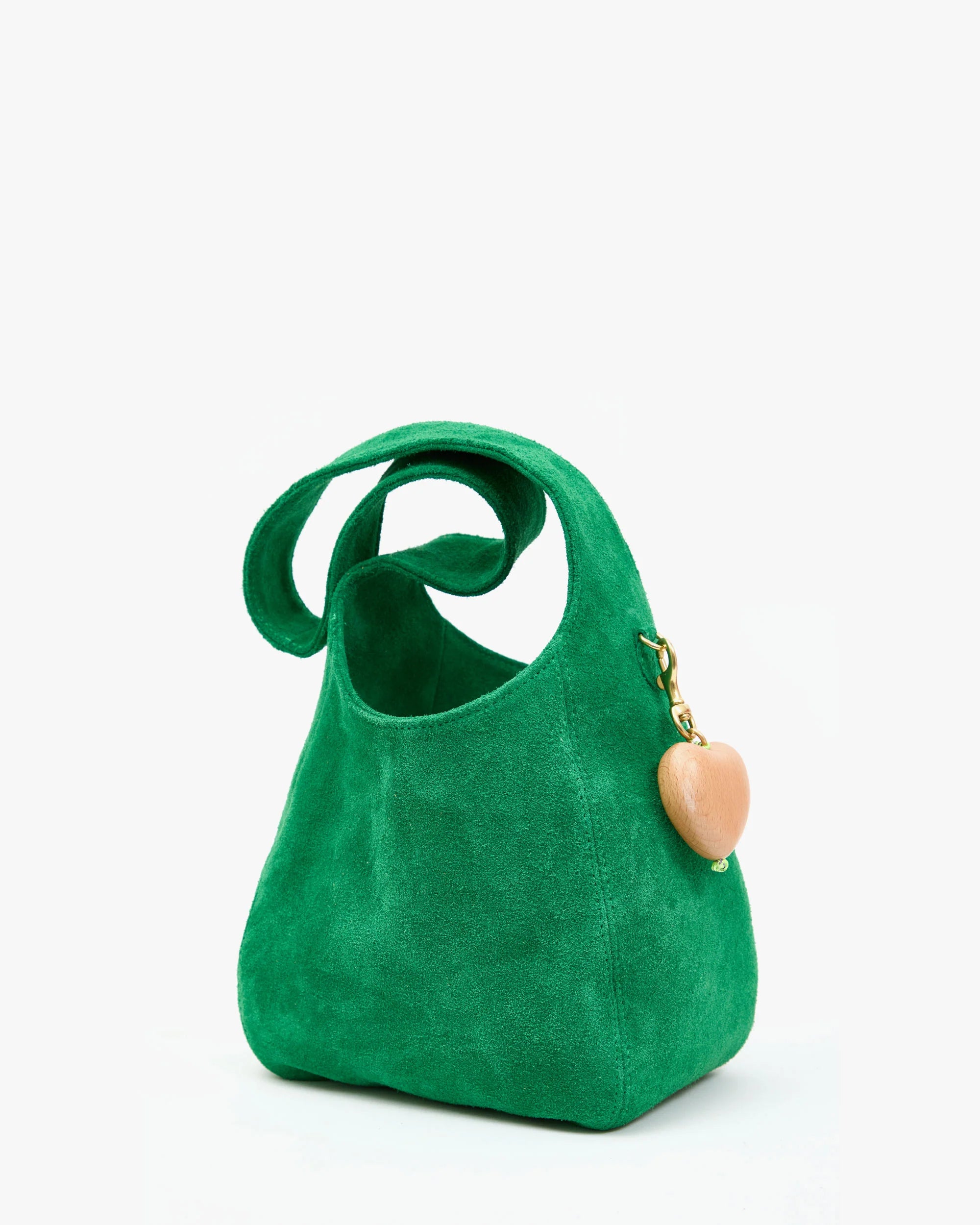 Green handbag with a heart-shaped charm on a white background