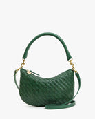 Green woven handbag with gold accents on a white background