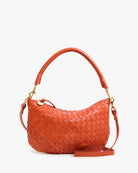 Orange woven handbag with gold accents on a white background