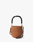 Woven handbag with black handle on a white background