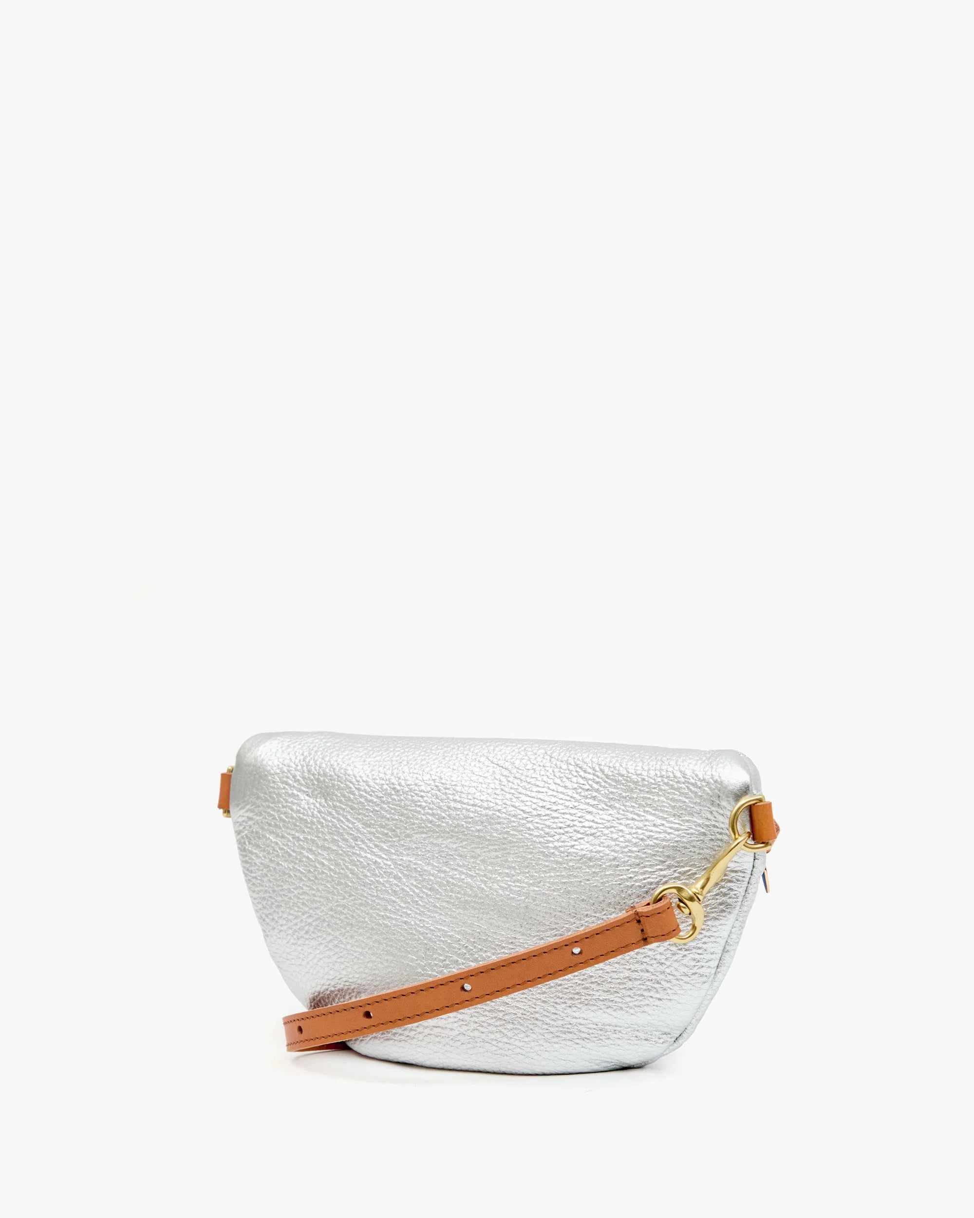 White textured handbag with a brown strap on a white background